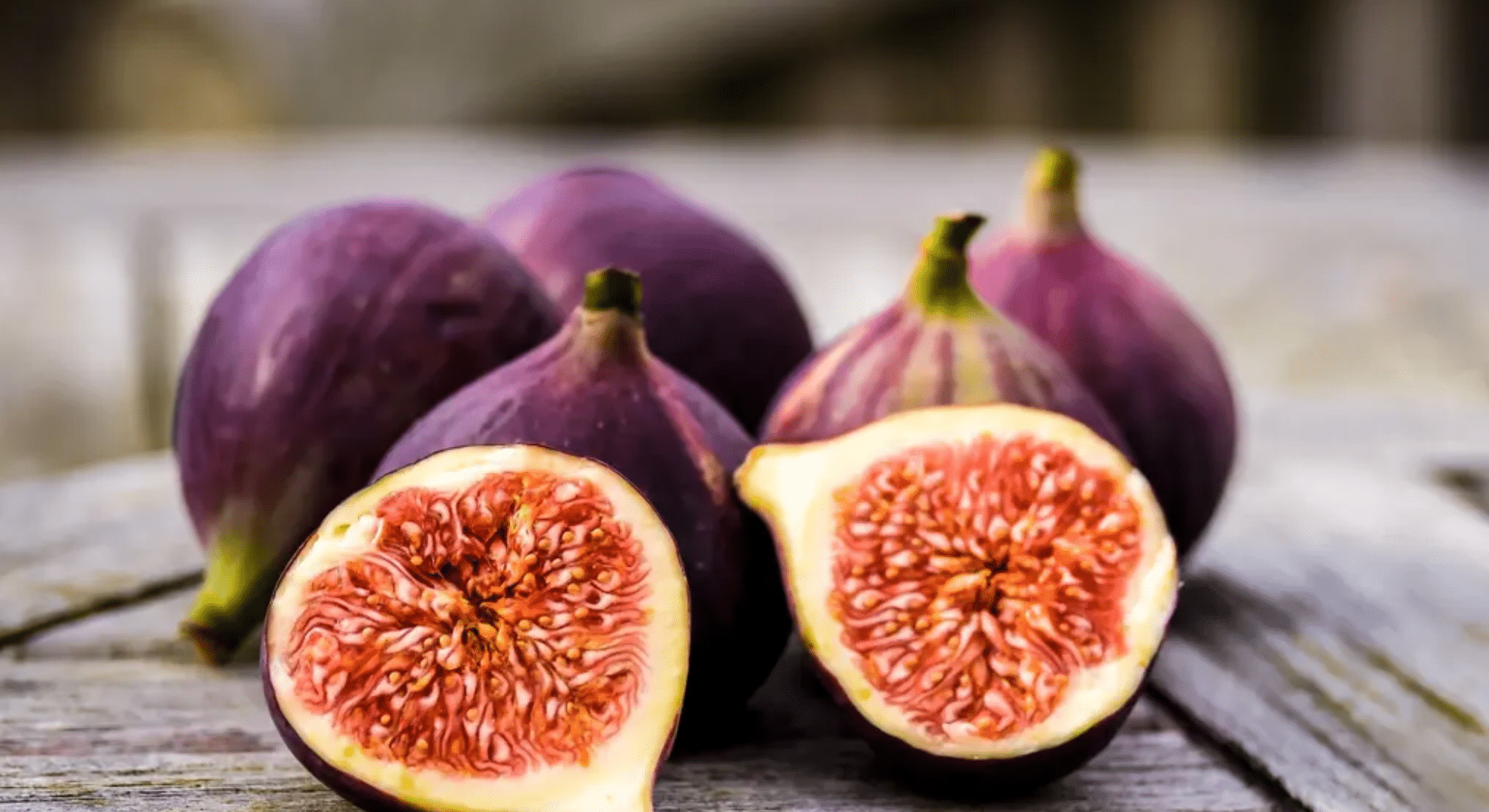 black mission fig with dark purple skin and pink interior