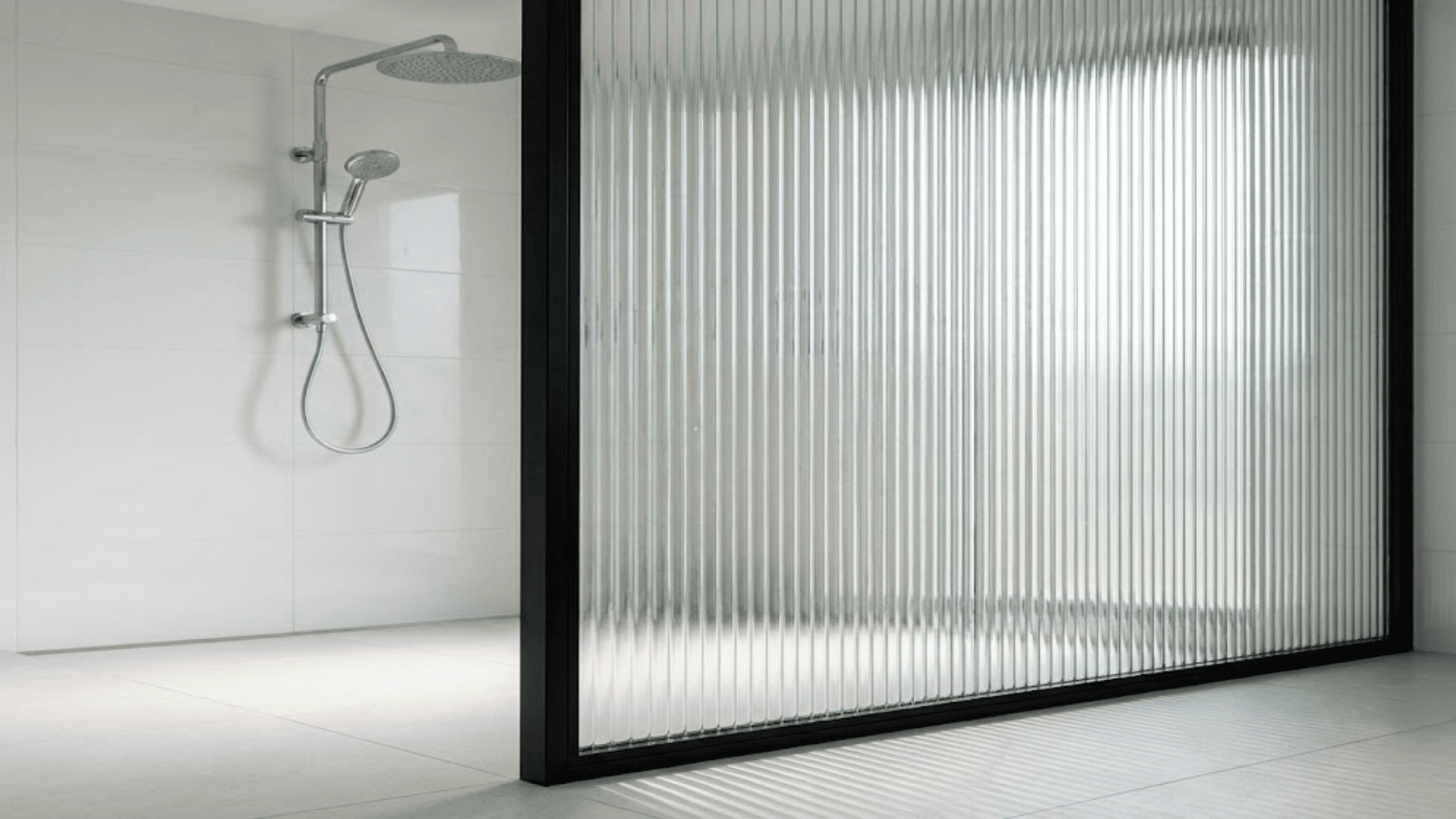 modern doorless shower with fluted reeded glass panel in black frame creating privacy and style