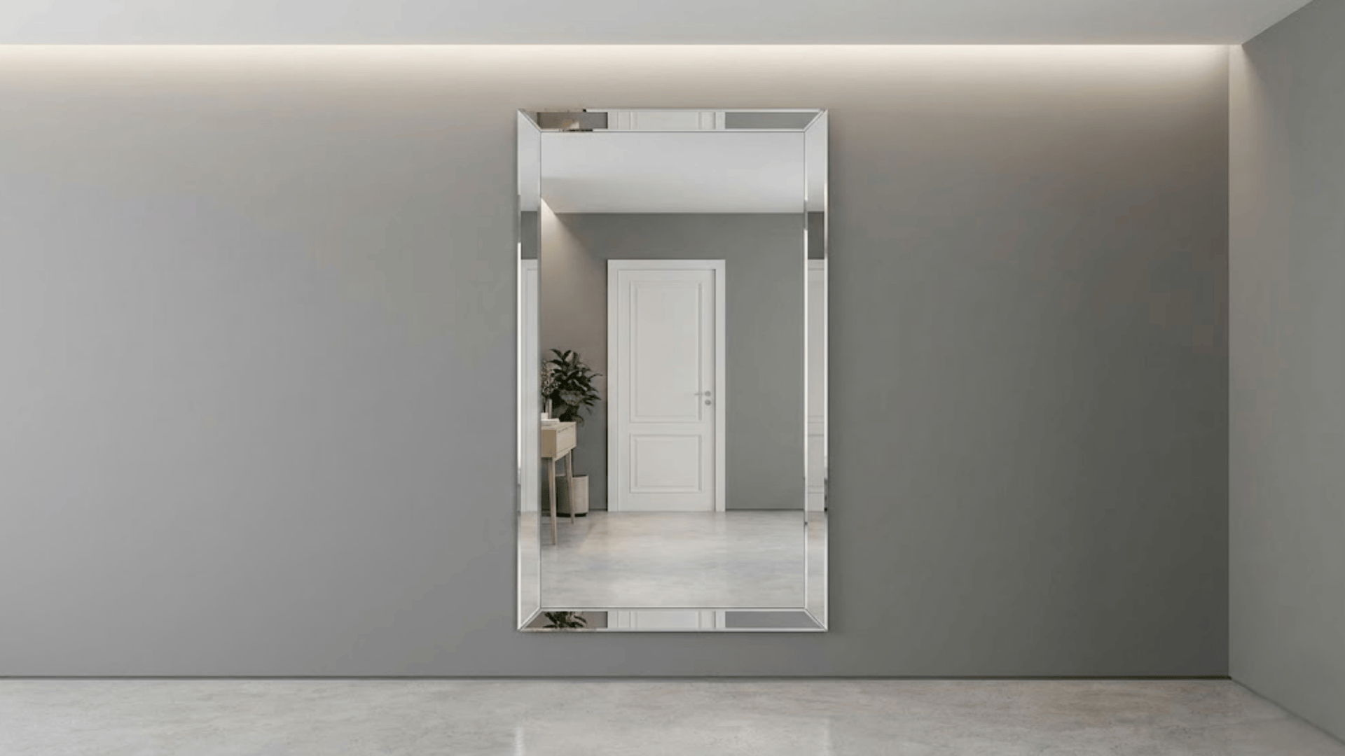 large frameless mirror panel mounted flush on gray wall with beveled edges and seamless integration
