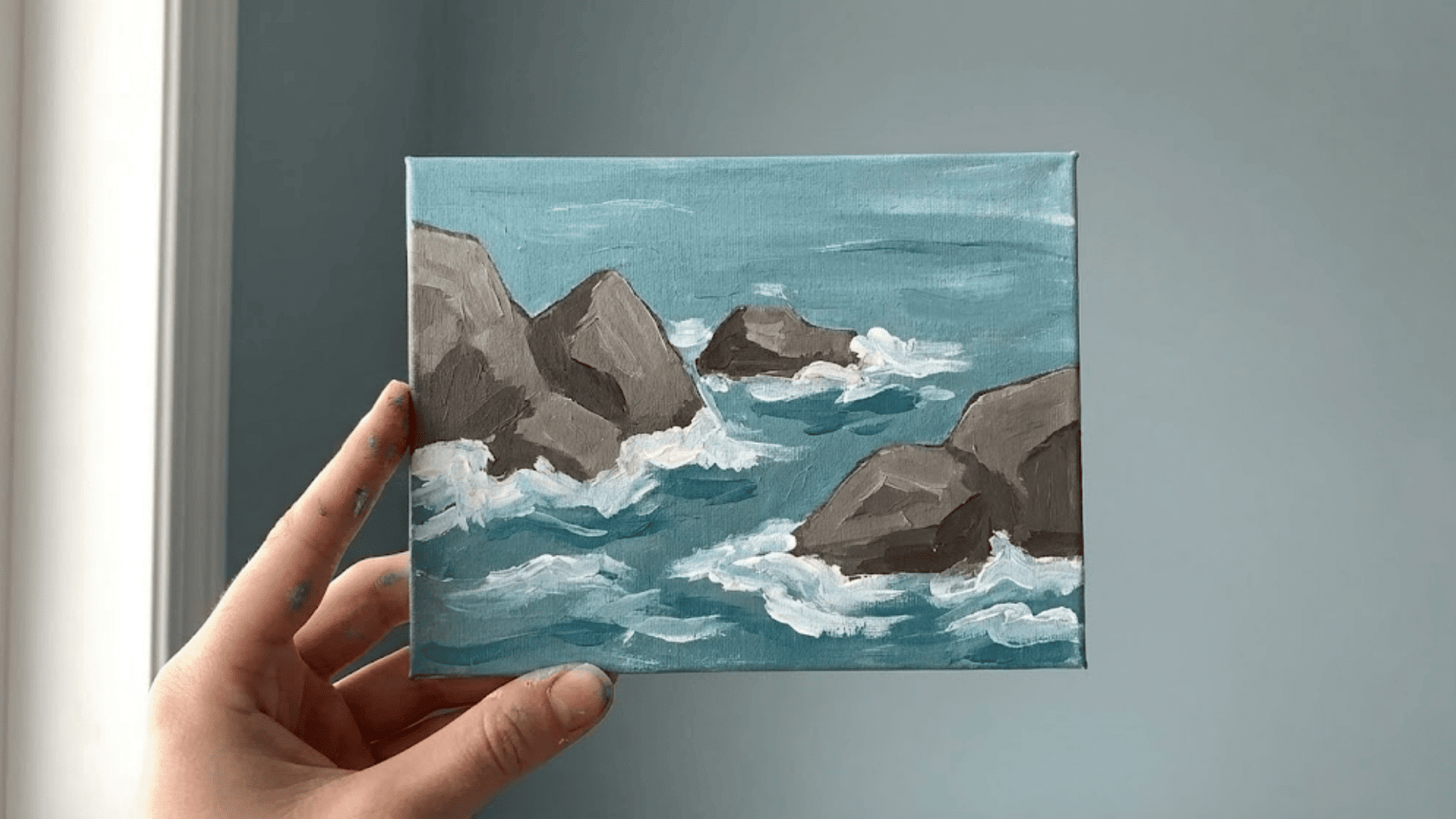 rocky shoreline with gentle waves