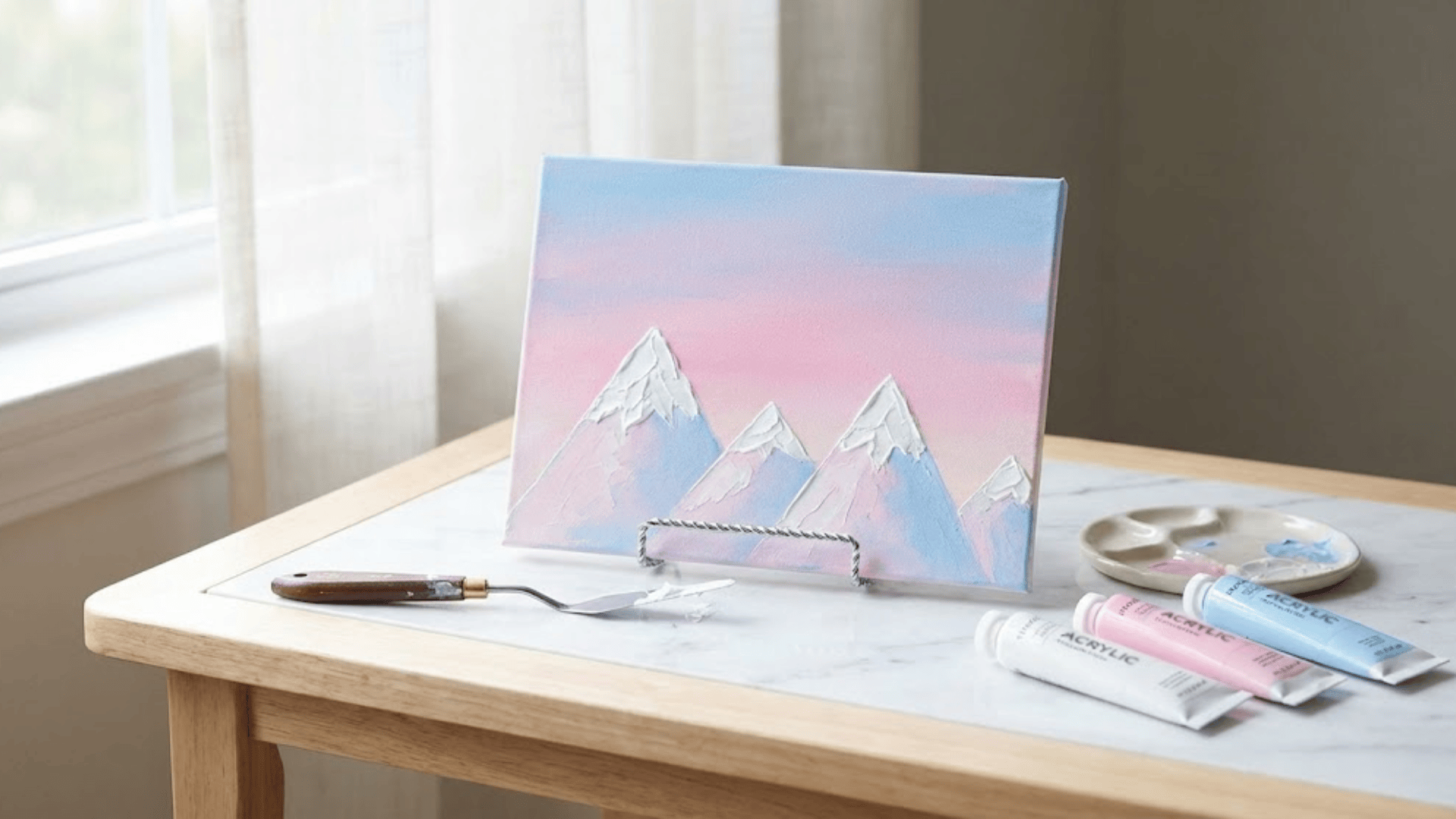 snow capped mountains with a pastel sky