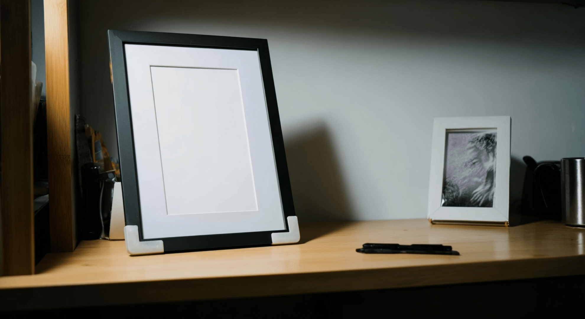 add a standing photo frame instead of taping photos