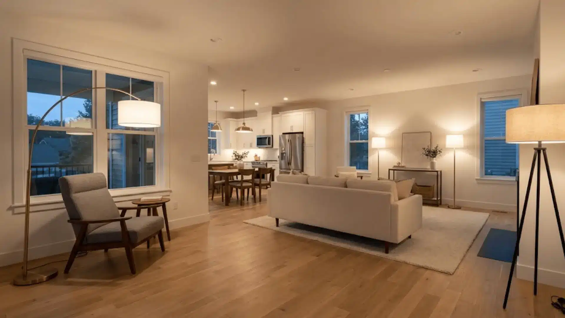 floor lamps in corners defining living room zones in open floor plan