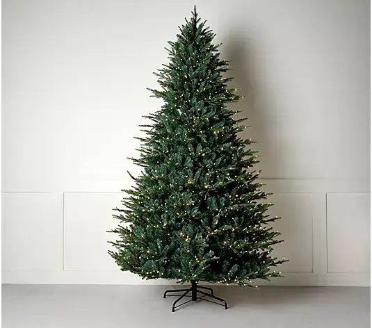 Decorated artificial Christmas tree with lights in minimalist indoor setting