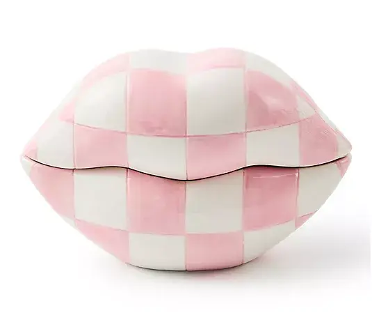 Pink and white checkered ceramic lips on white background