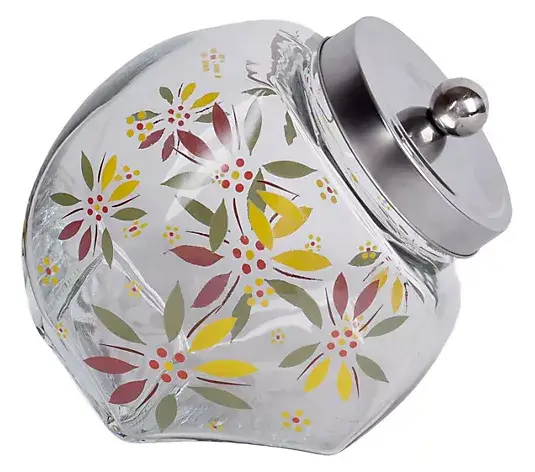 Glass jar with floral design and metal lid on white background