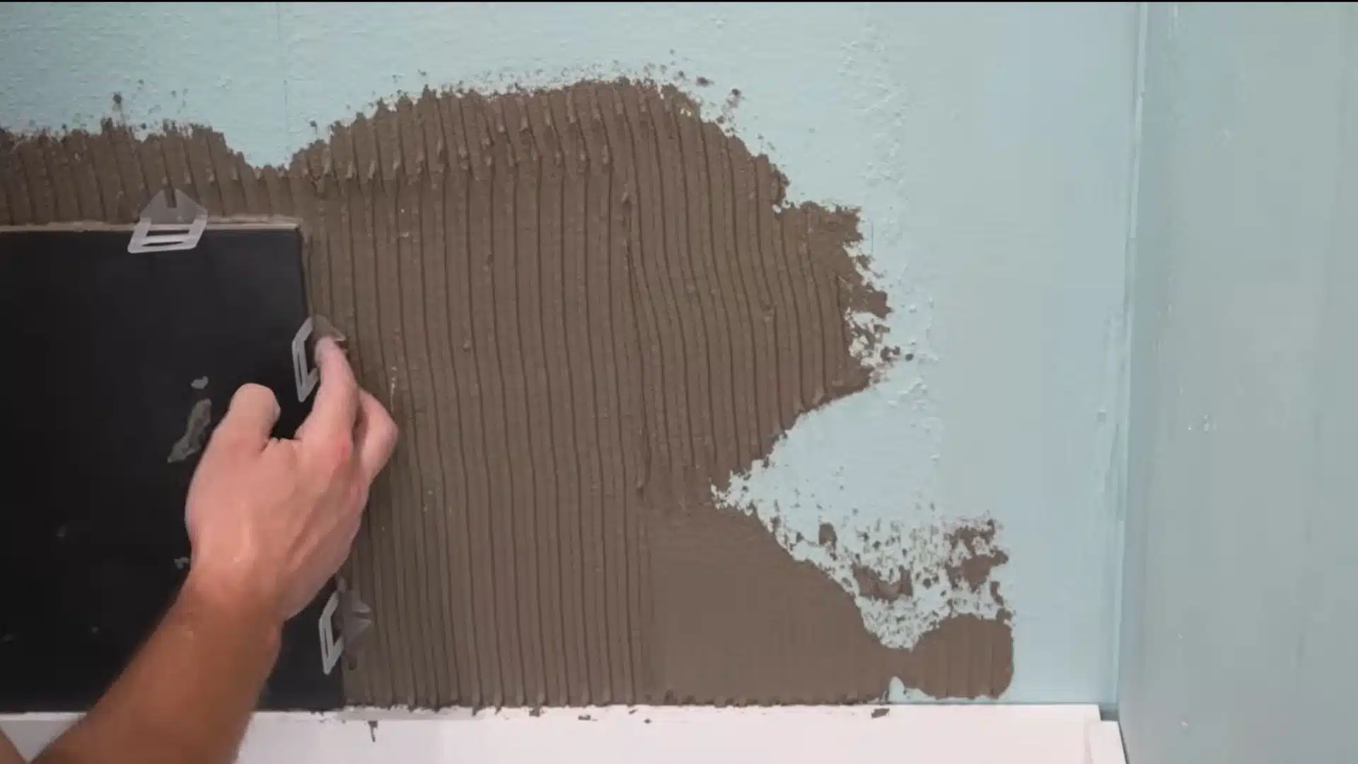 set the back wall tiles with spacers