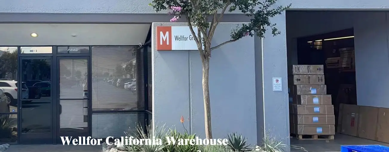 Warehouse entrance with loading dock and stacked cardboard boxes nearby