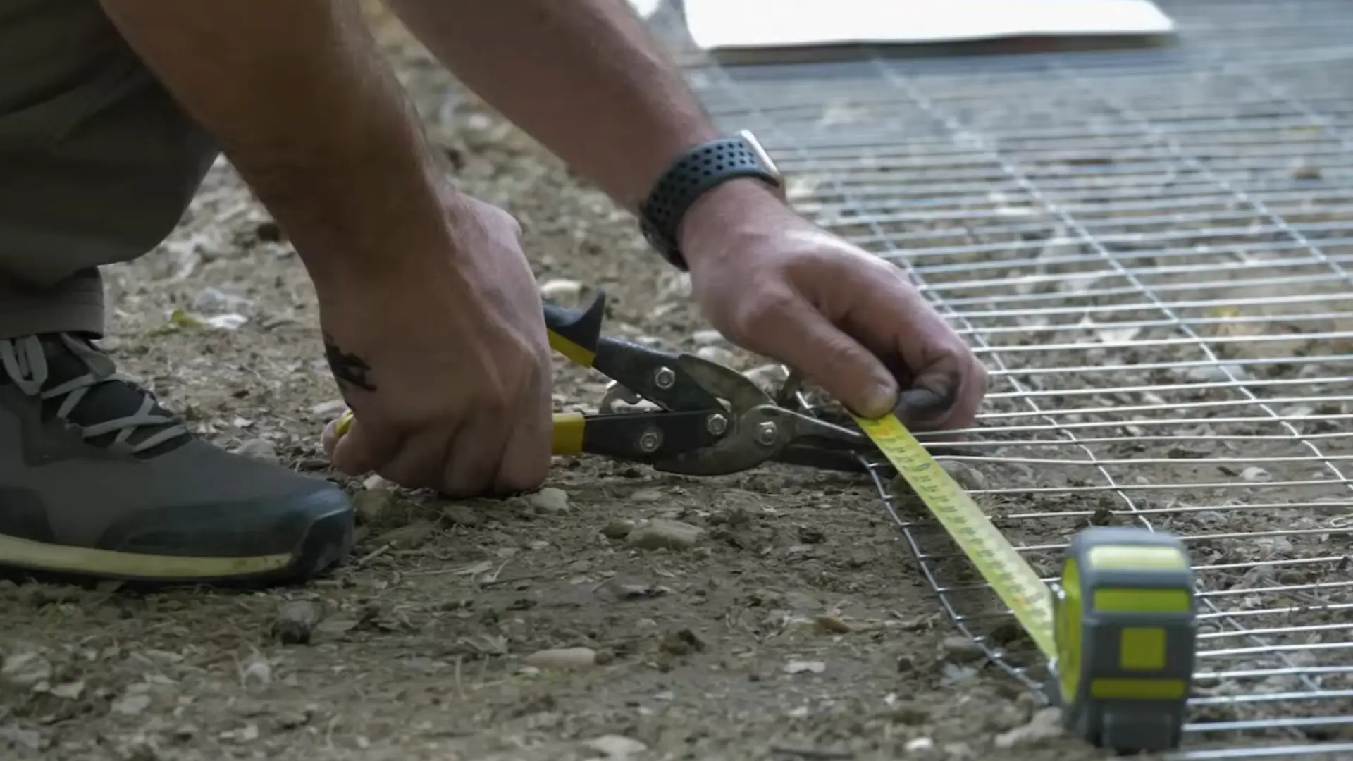 attaching wire mesh to complete a secure chicken fence enclosure
