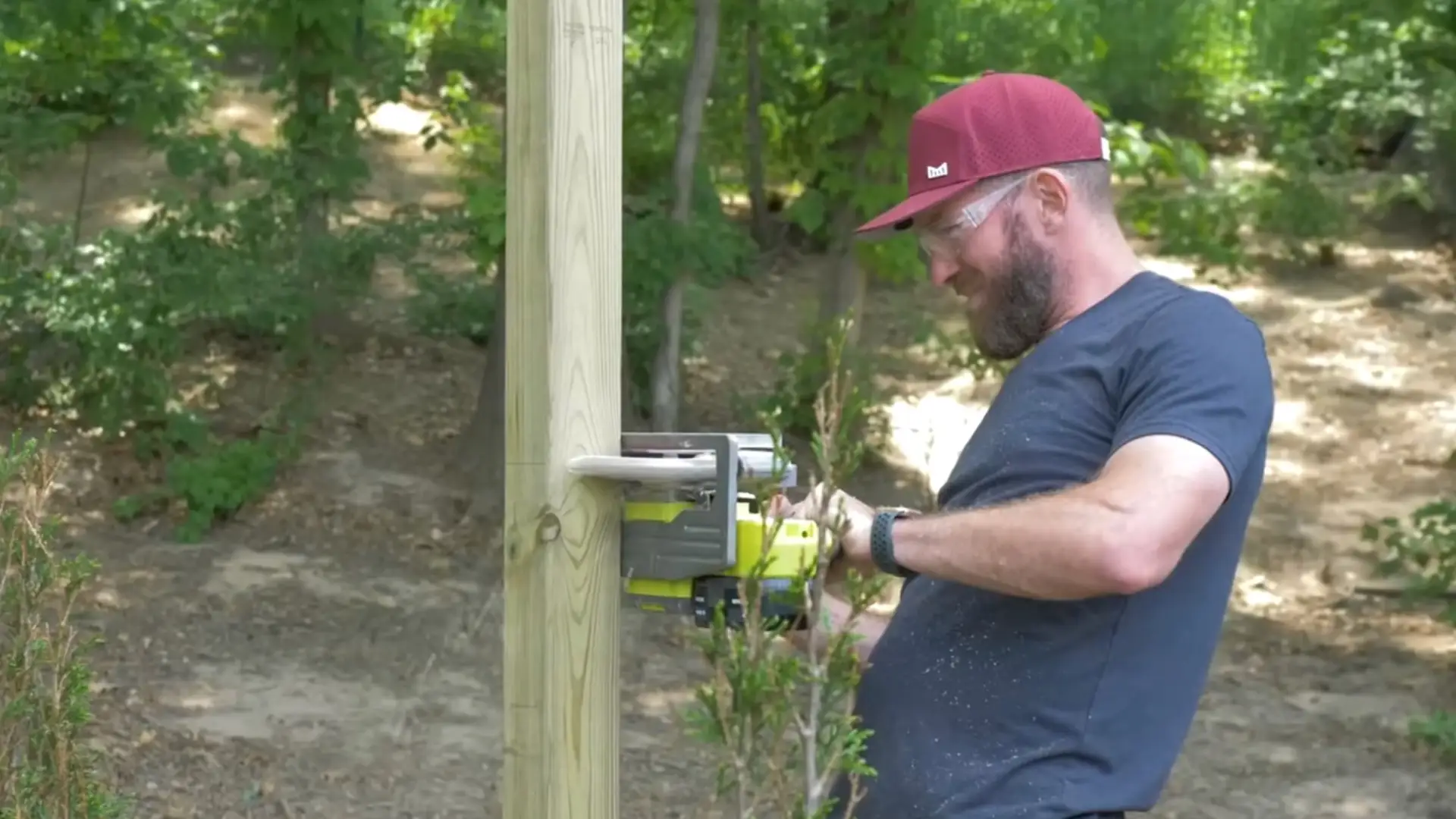 cutting fence posts and adding wooden stretchers to strengthen the frame structure