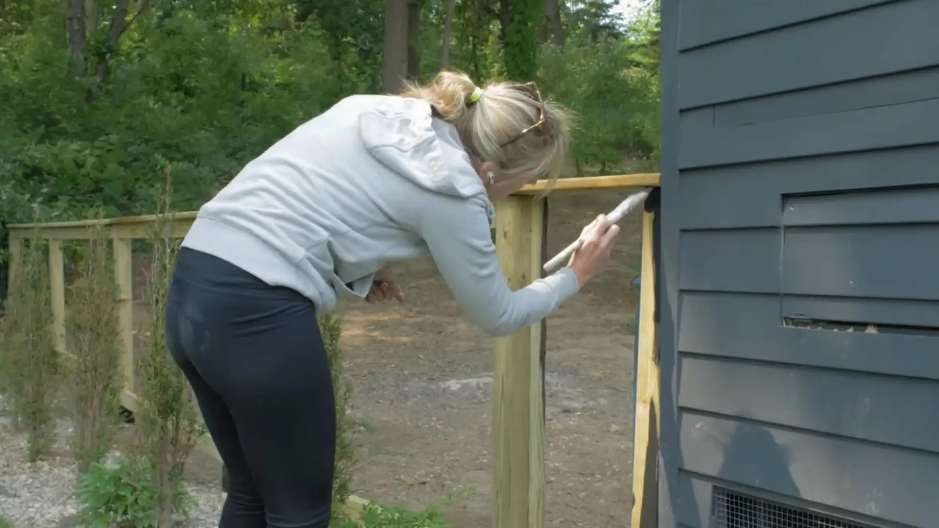 adding a wooden fence cap and applying exterior stain for protection